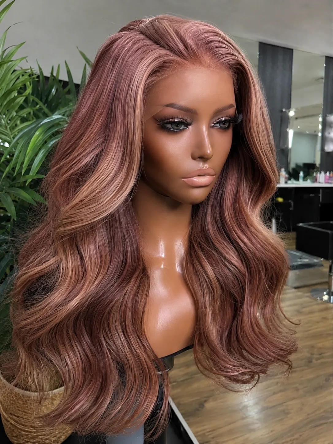 Rose gold mauve wavy lace front wig on mannequin
